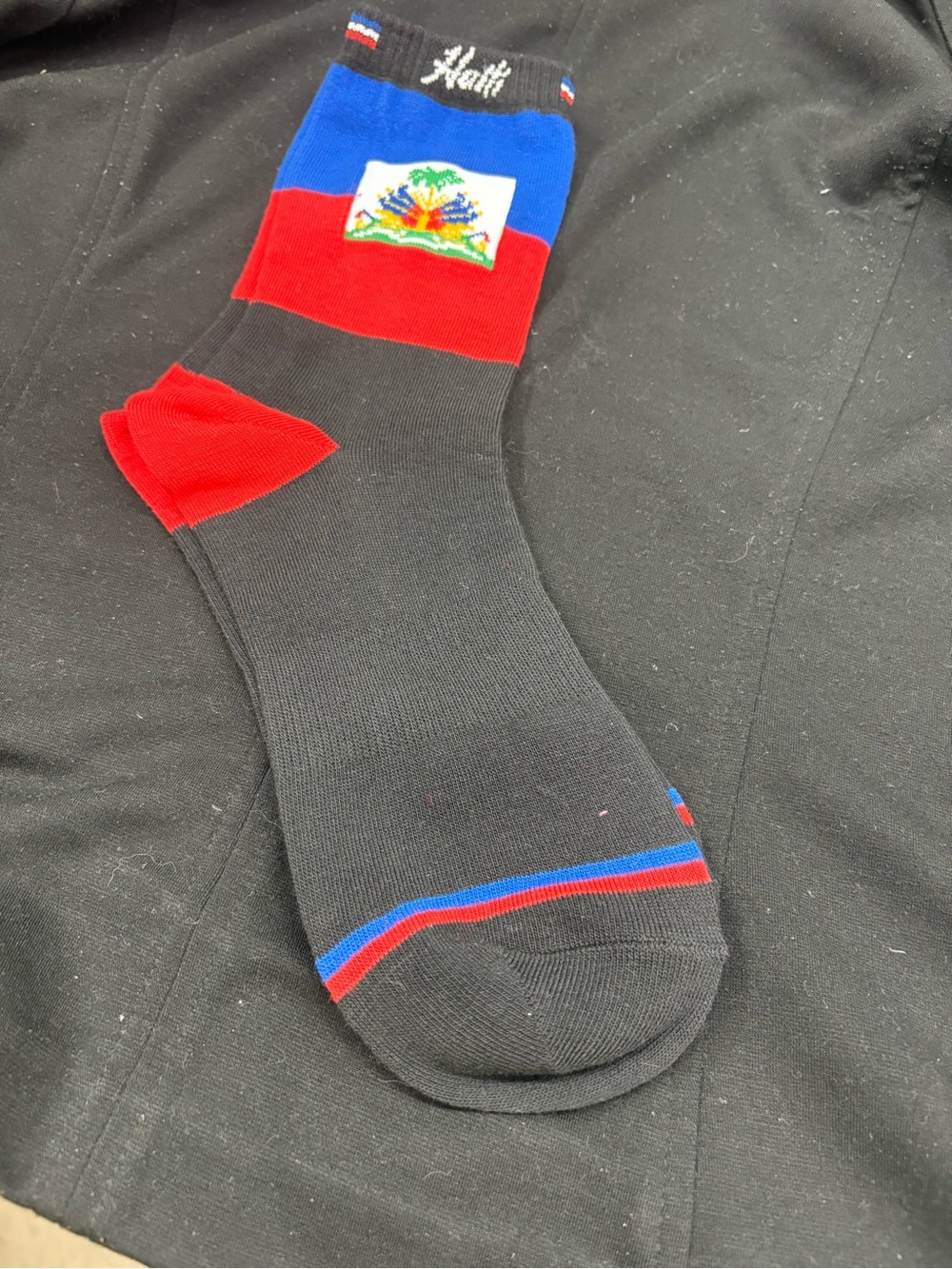 Cozy Casual Black Crew Socks with Red & Blue Accents comes in prepackaged seal